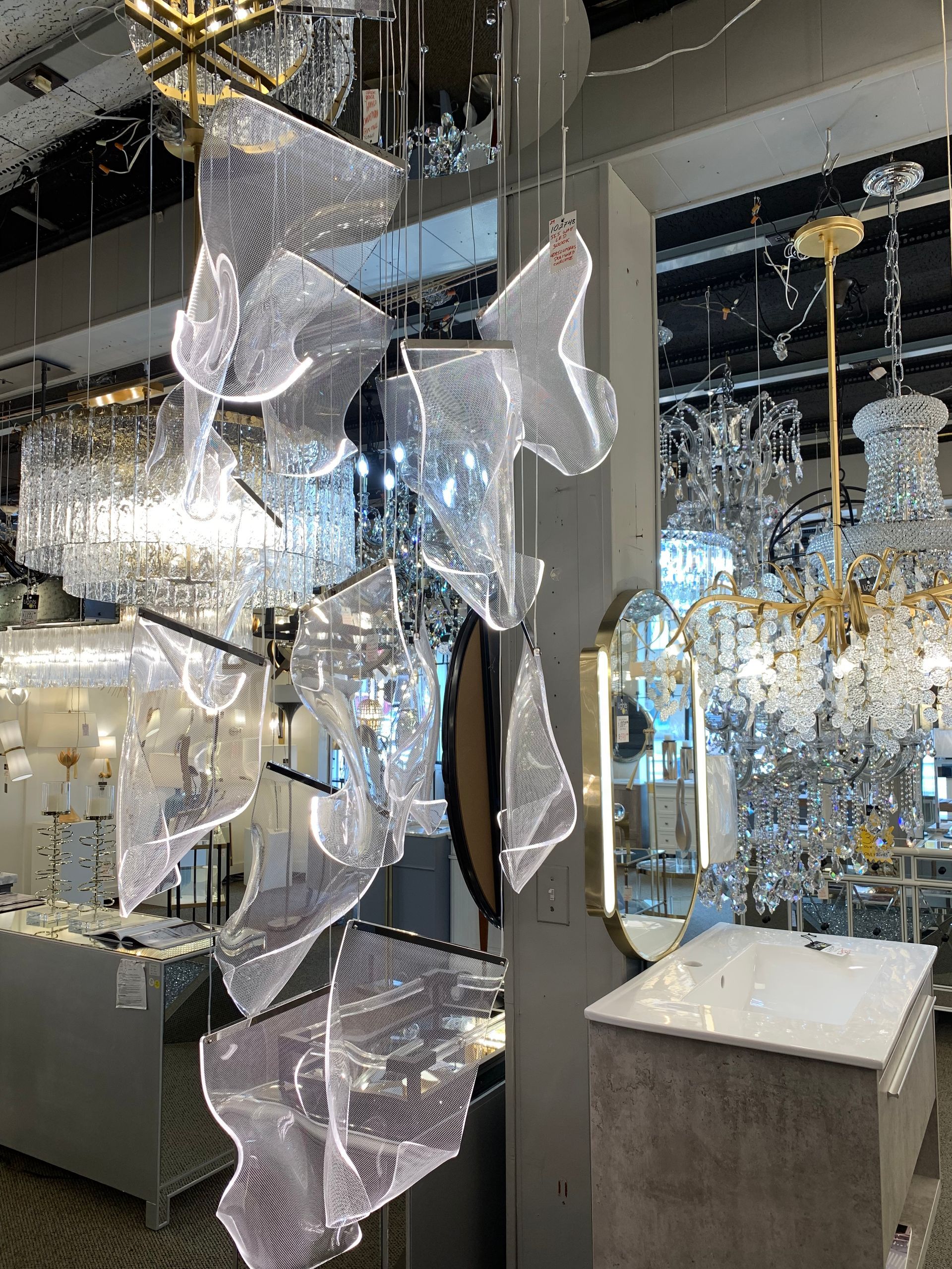 A room filled with lots of chandeliers and a mirror.