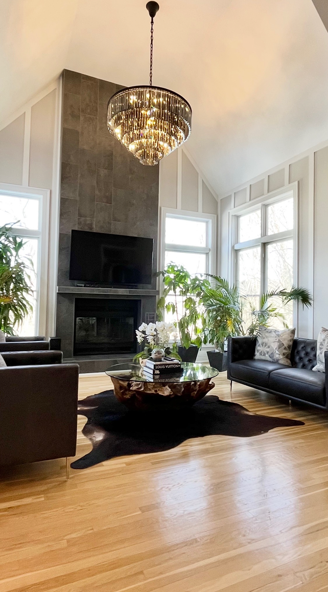 A living room filled with furniture and a fireplace.