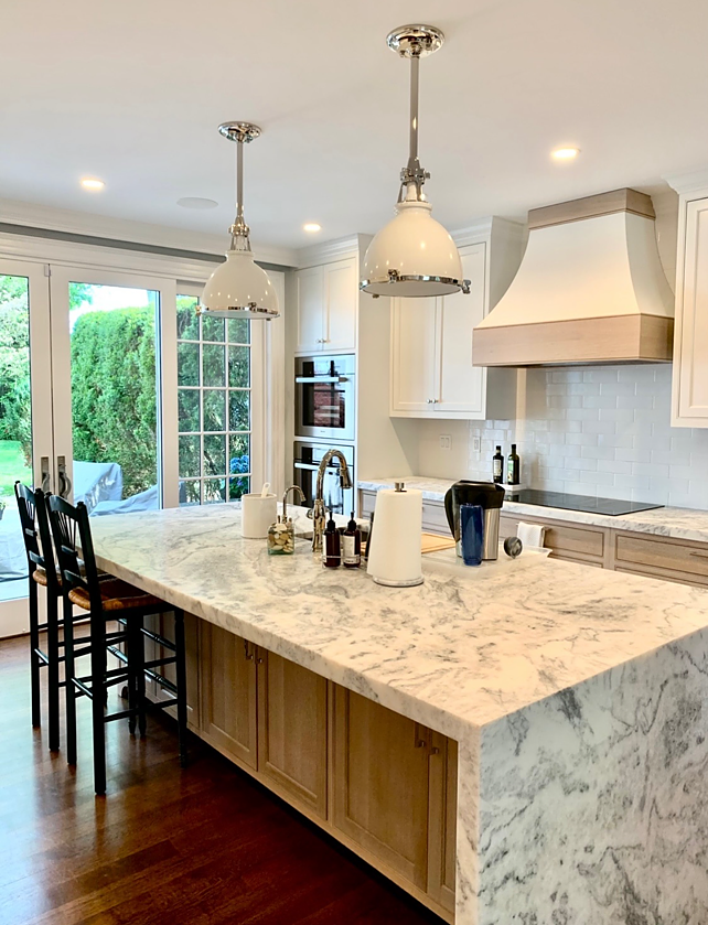 There is a large island in the middle of the kitchen.