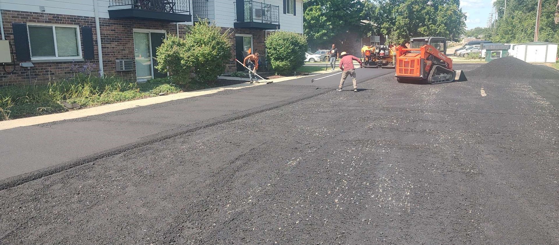A group of people are working on a road.