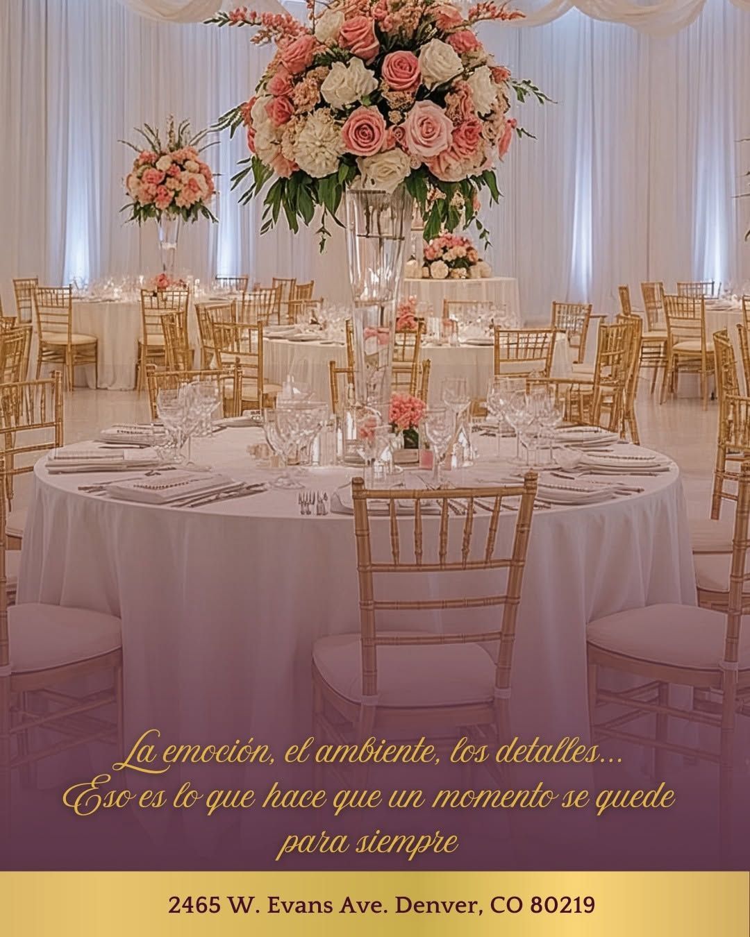 Elegant wedding reception table with pink floral centerpiece, gold chairs, and white drapery backdrop