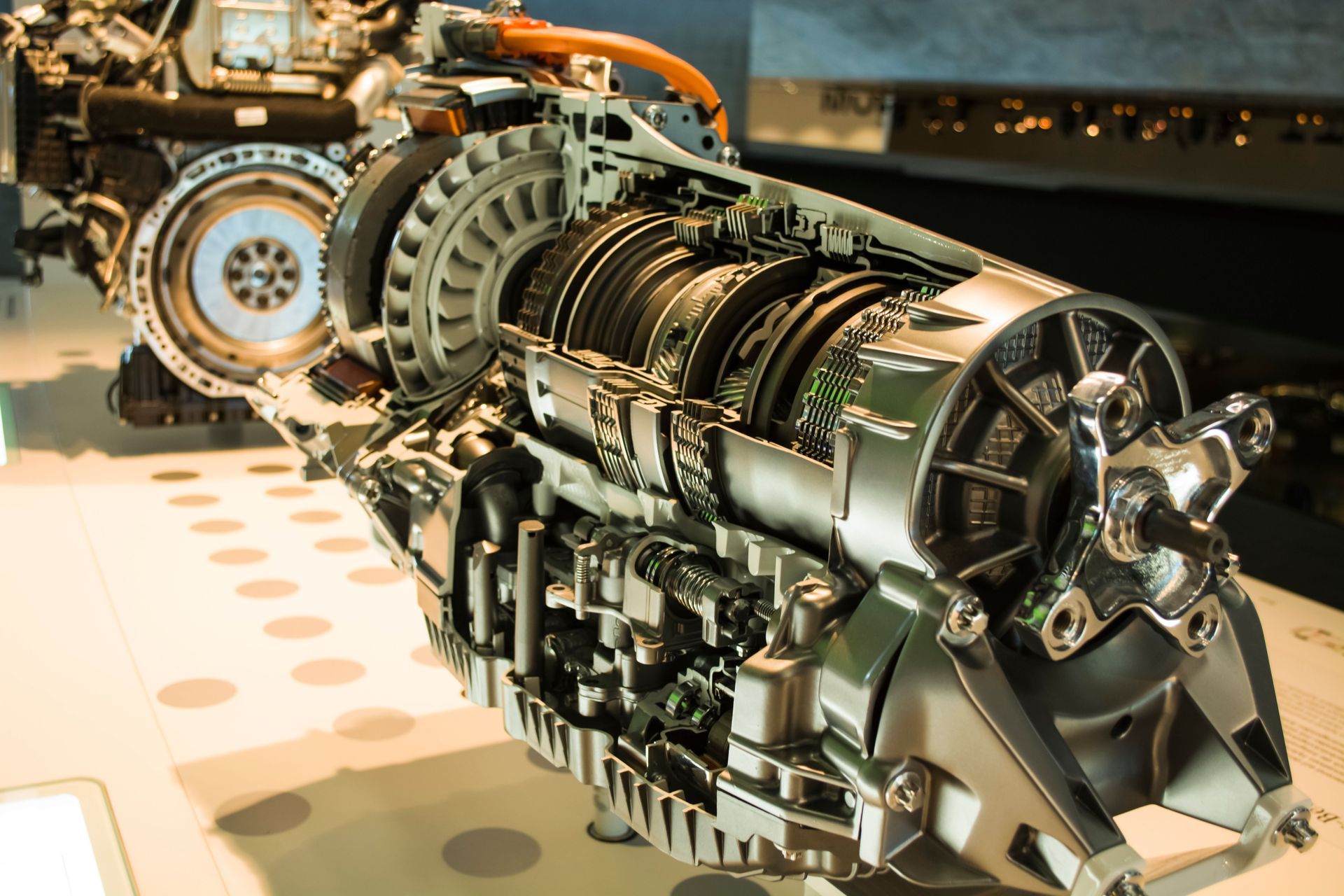 Cutaway view of an automatic car transmission system showing internal components and gears.