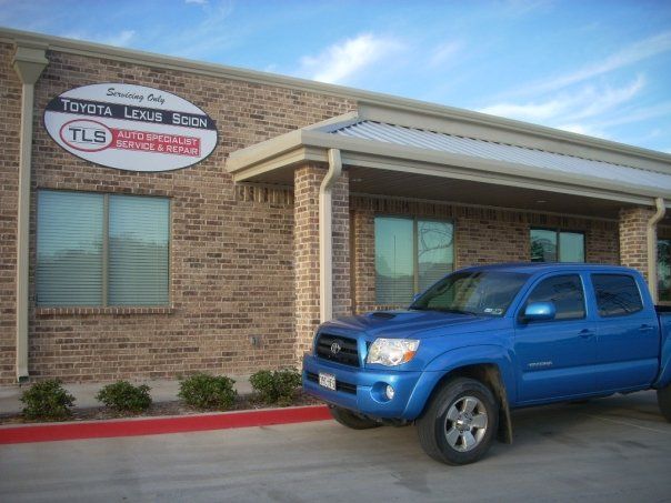 TLS Auto Specialist front with a blue car