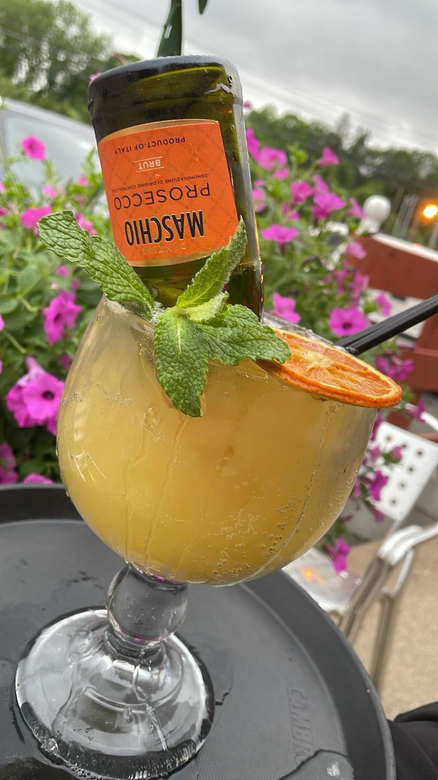 A refreshing drink in a glass on a tray