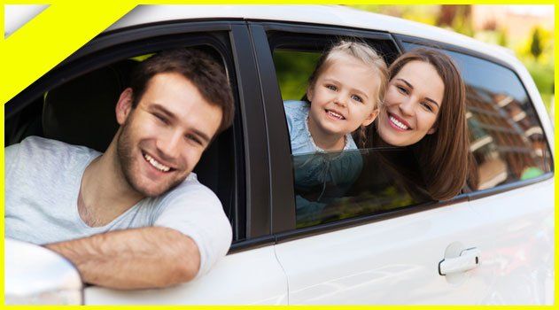 Happy family in a car