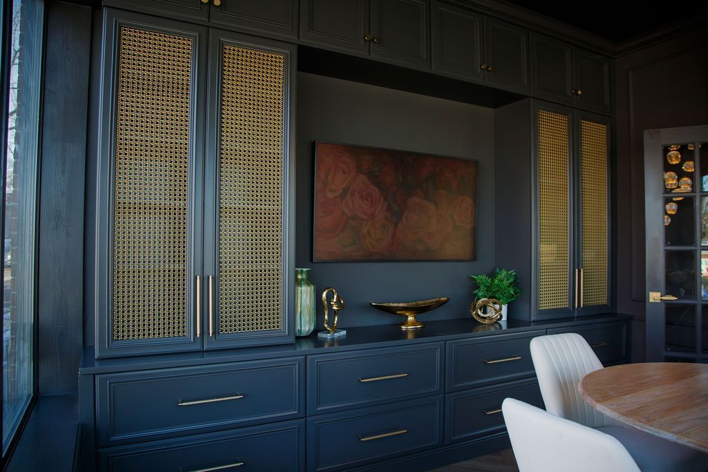 ark blue built-in storage unit with gold accents.