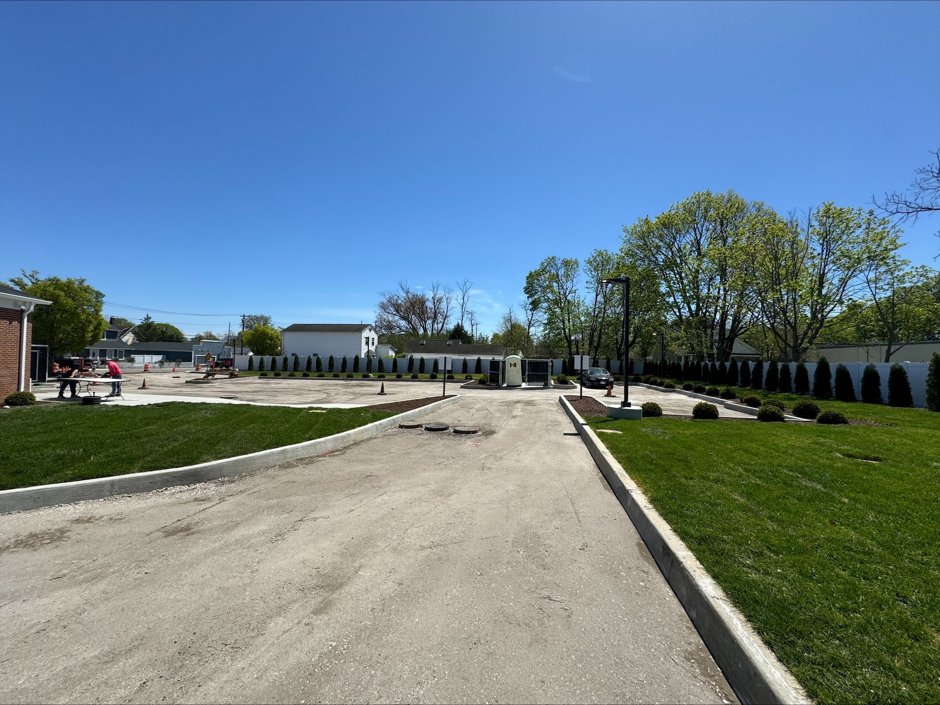 A Dunkin restaurant with a waterfall in front of it.