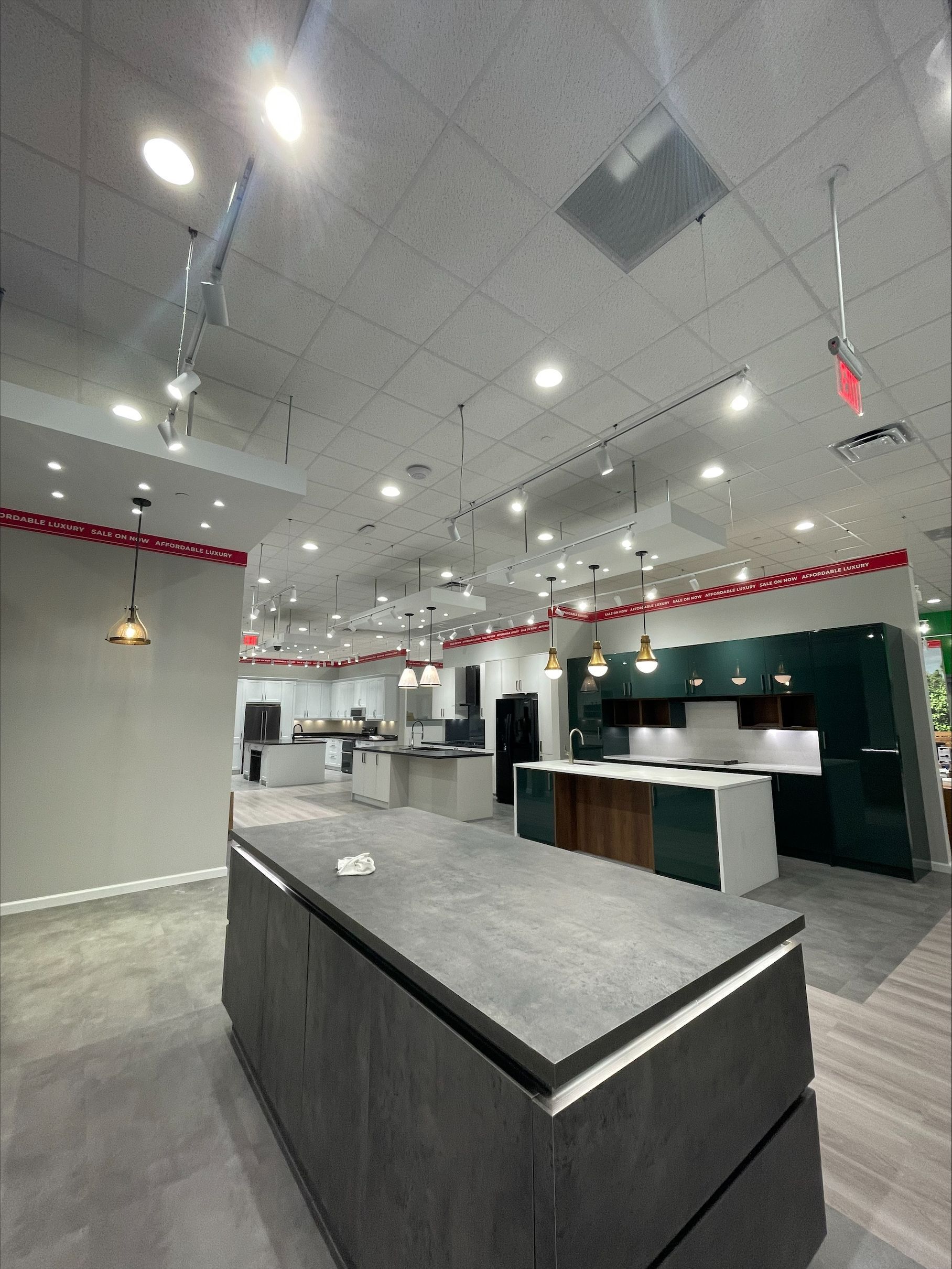 A kitchen with a large island in the middle of the room