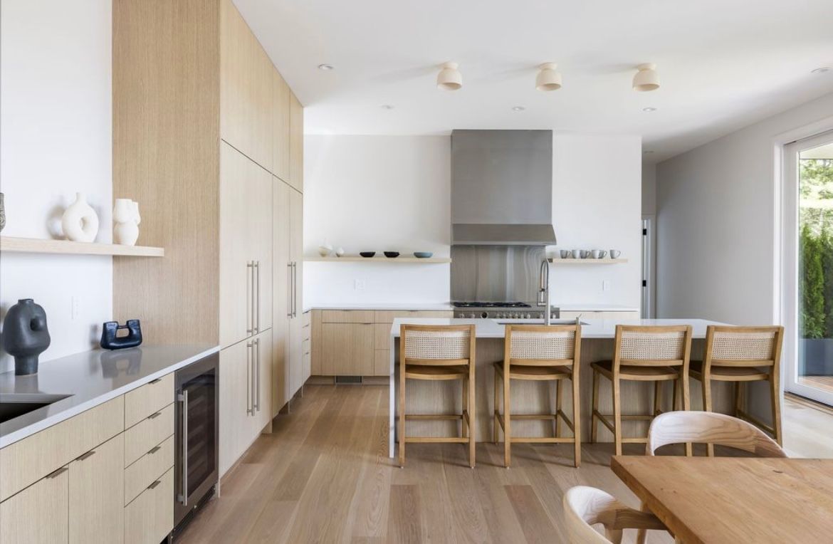 A kitchen with stainless steel appliances and wooden cabinets