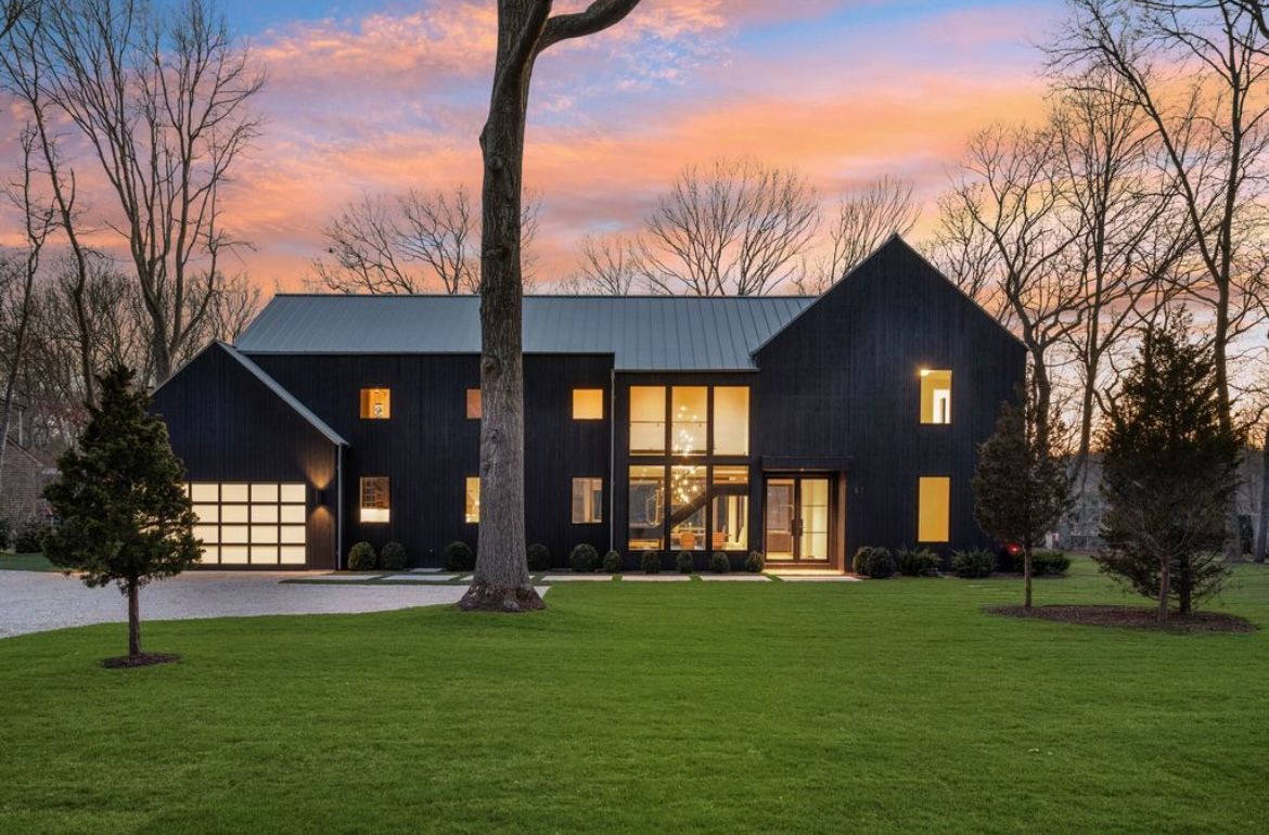 A large white box is sitting in front of a house