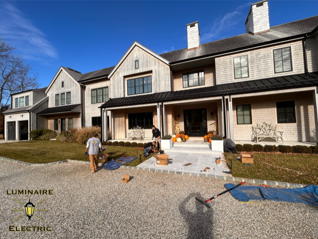 A kitchen with white cabinets and a wine cooler