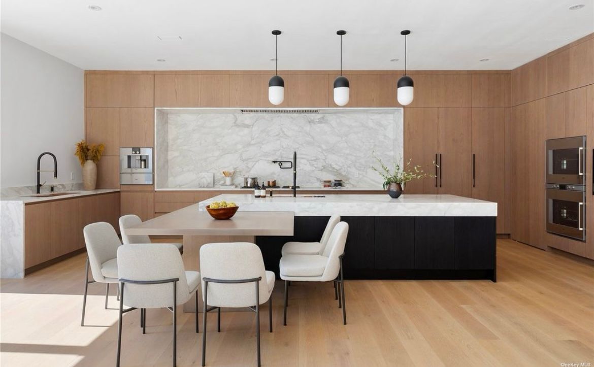 A kitchen with a table and chairs in it