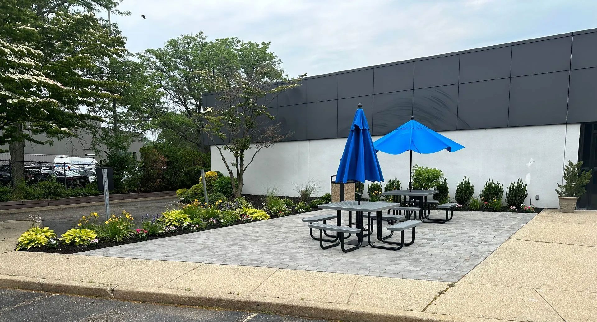 A patio area with tables and umbrellas
