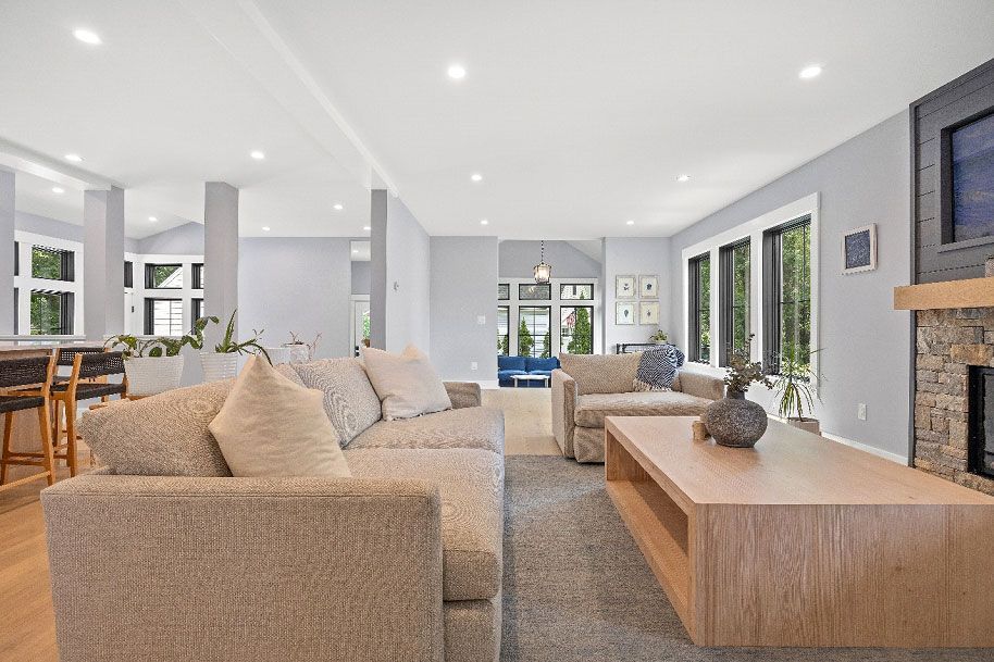 A living room filled with furniture and a fireplace