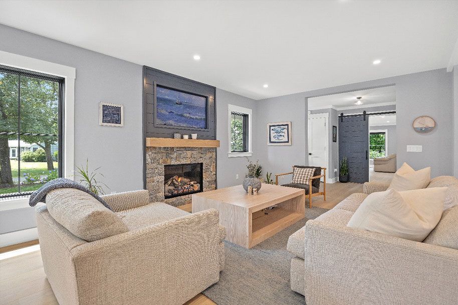 A living room filled with furniture and a fireplace