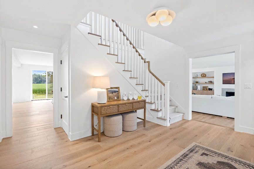 There is a staircase in the middle of the hallway