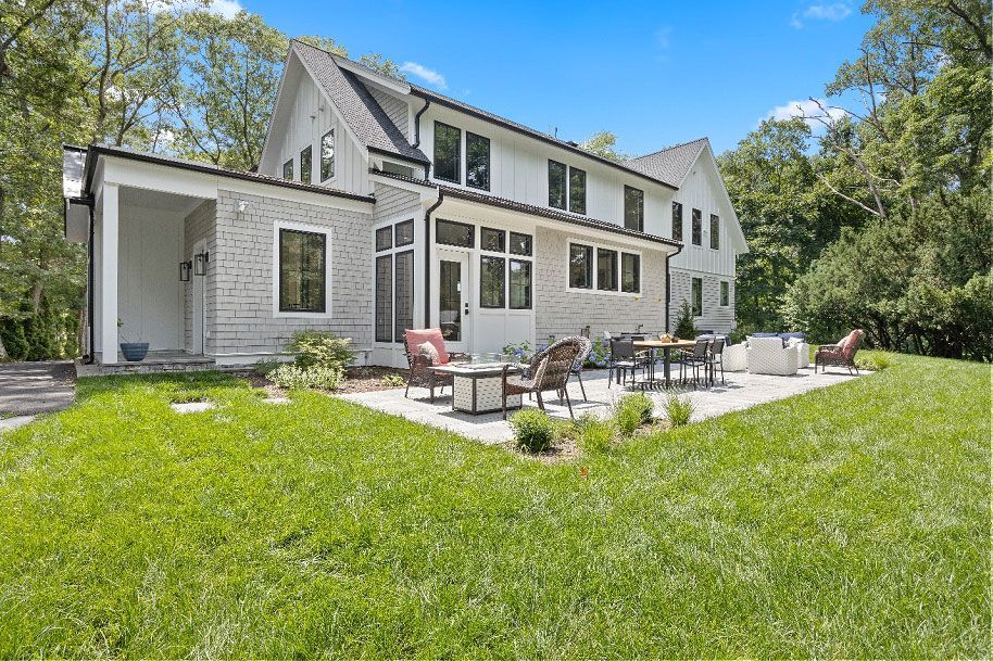 A large white house with a patio 