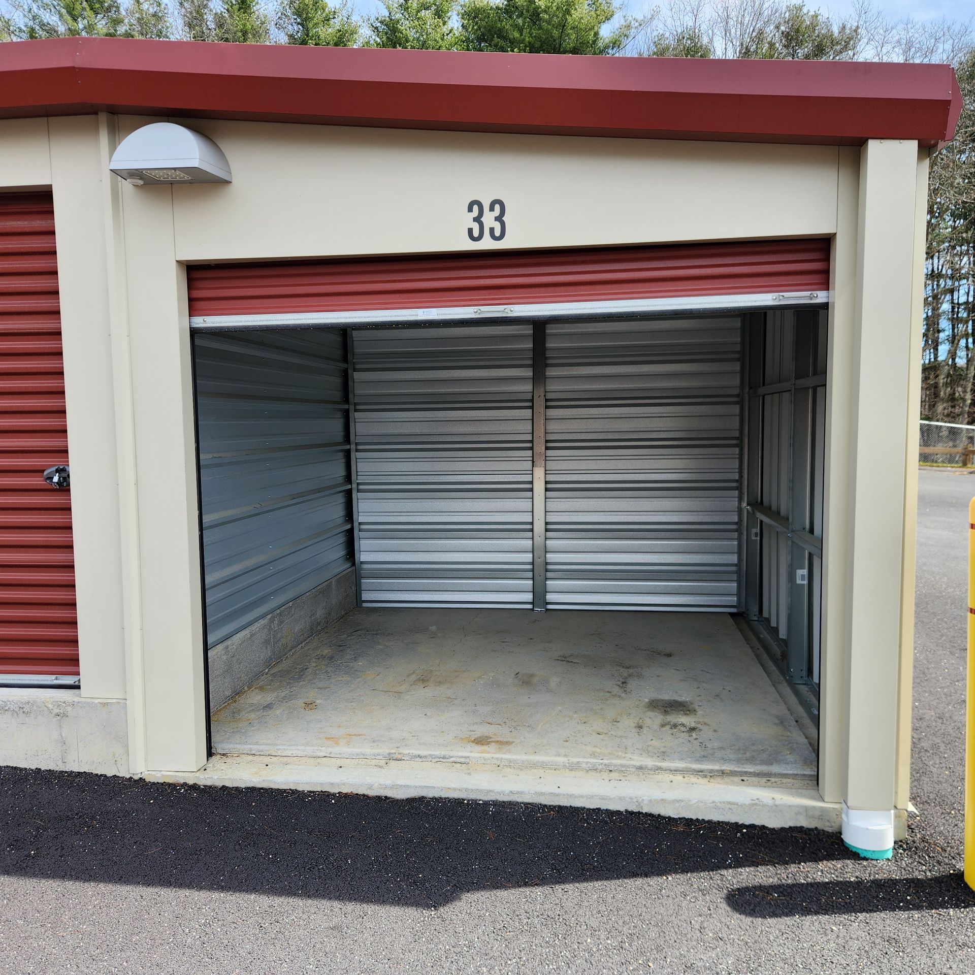 An empty storage unit with the number 33 on it