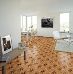 Living room with patterned wood floor, white walls, table, chairs, art, and rug.