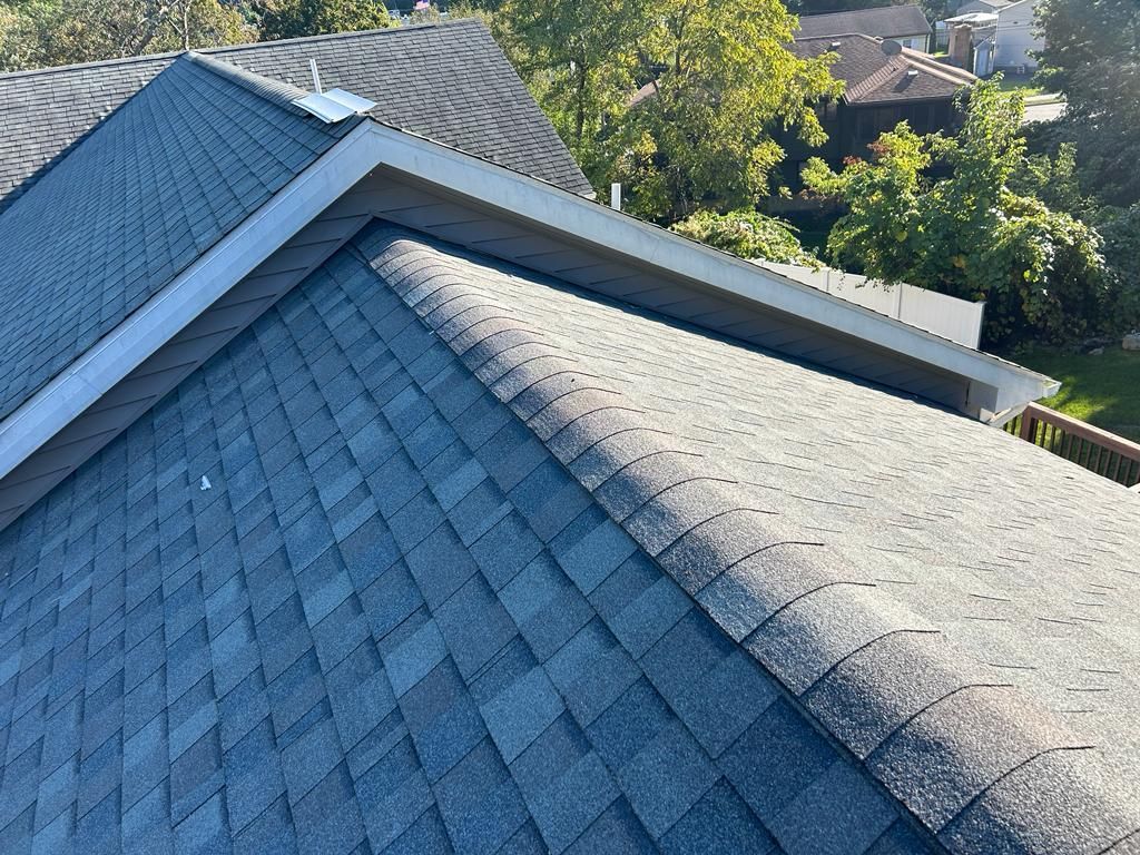 A close-up of a roof with a lot of shingles on it.