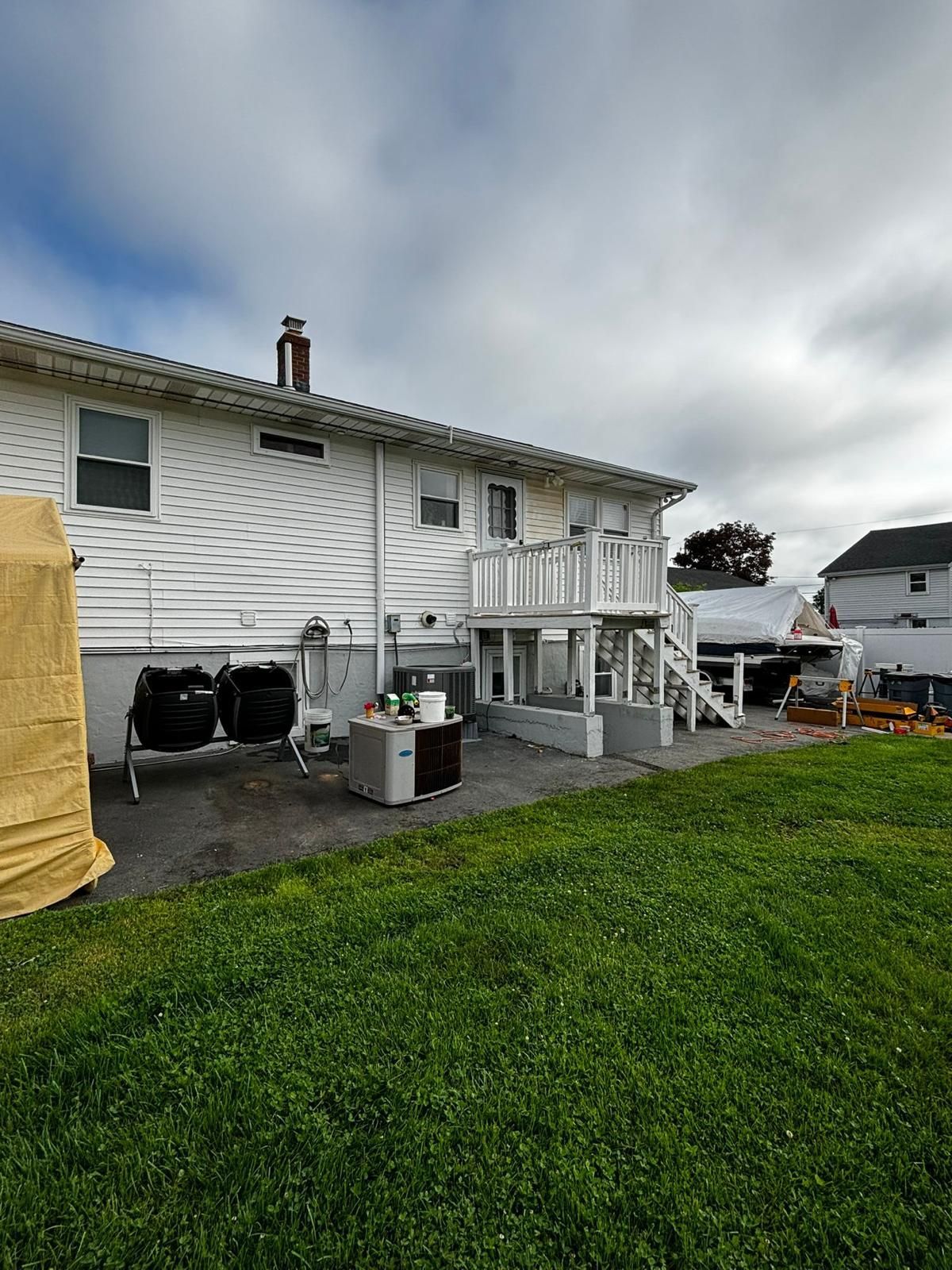 A large white house with a large lawn in front of it.