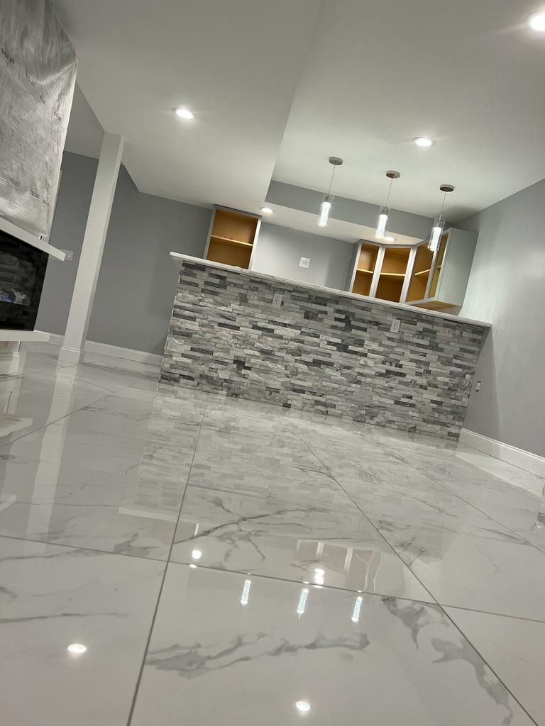 There is a stone wall in the middle of the room.