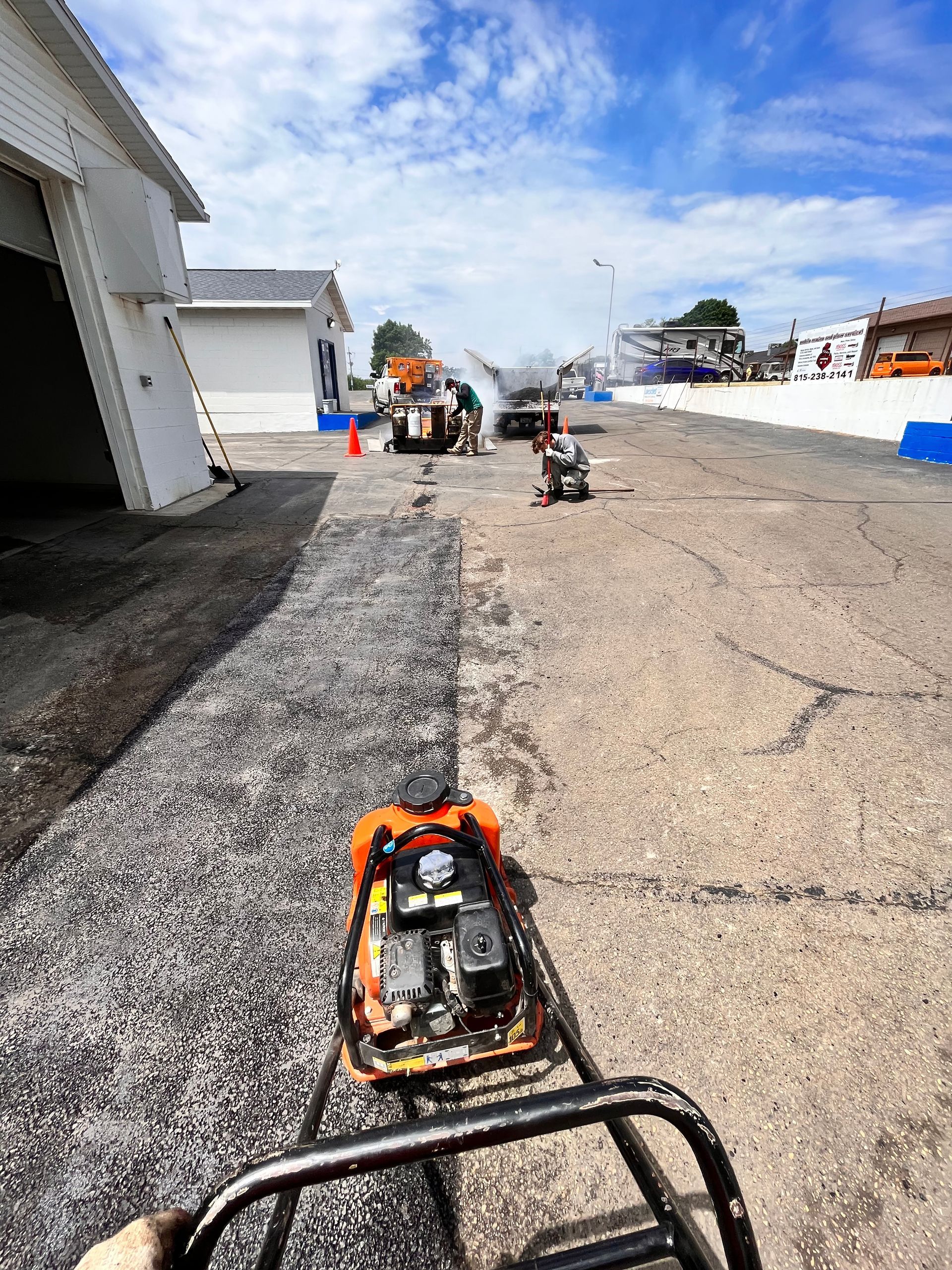 A person is riding a go kart on a track.
