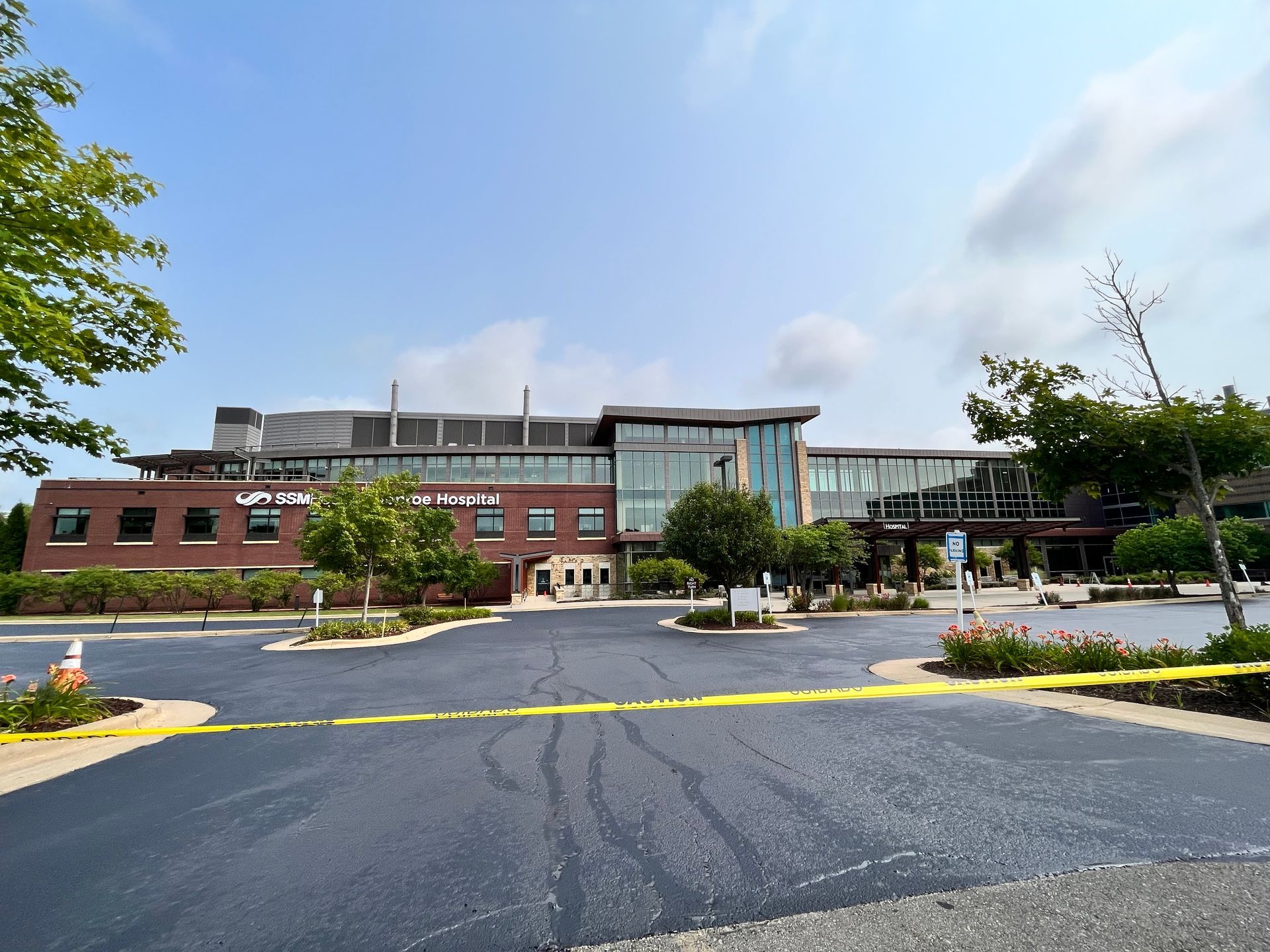 A parking lot with a handicapped parking spot painted in blue