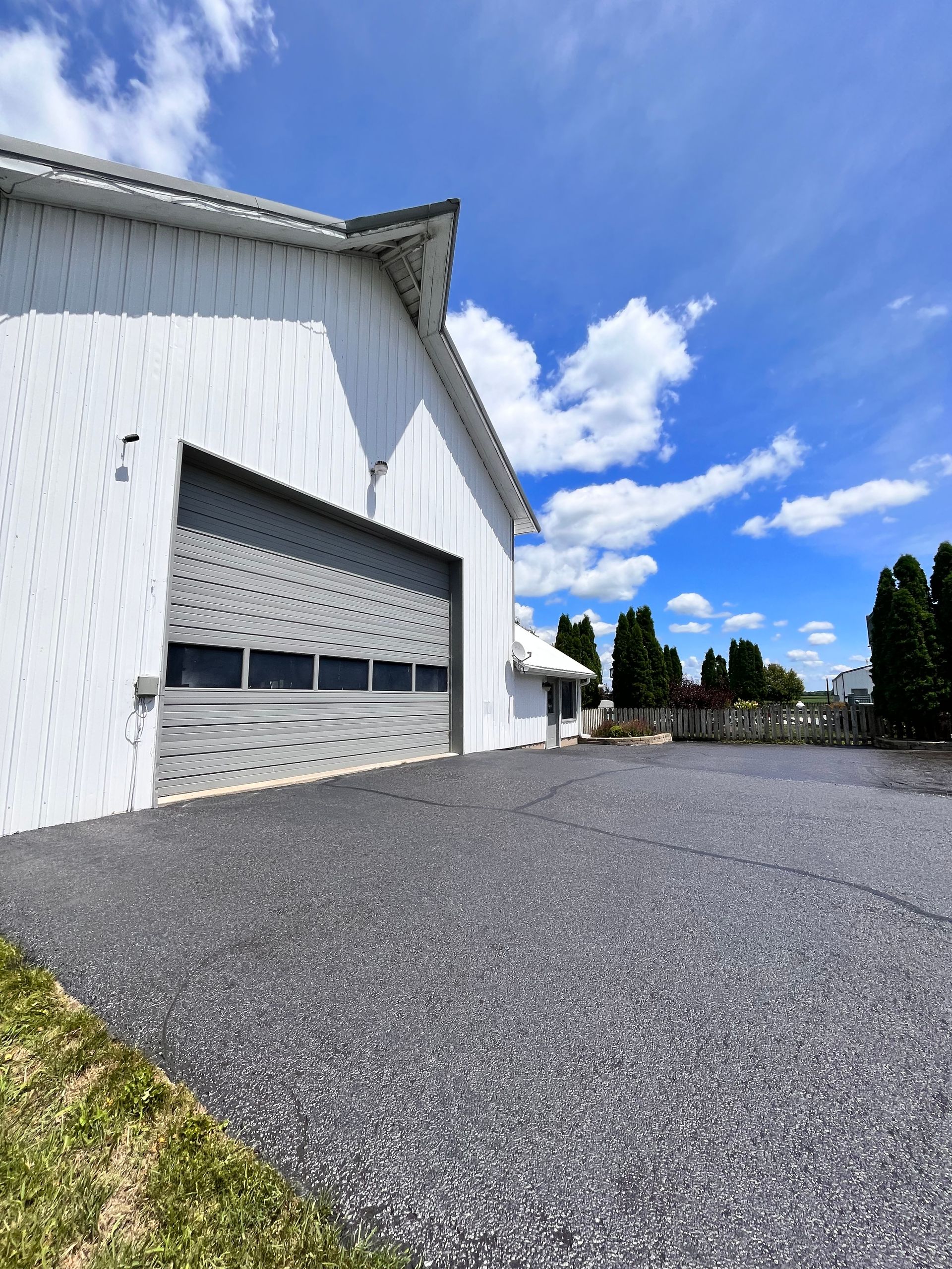 A parking lot with handicapped parking spaces and a building in the background
