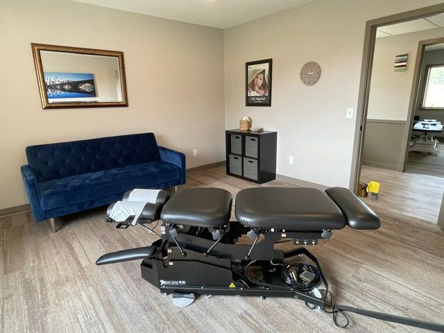 A room with a couch and a table in it