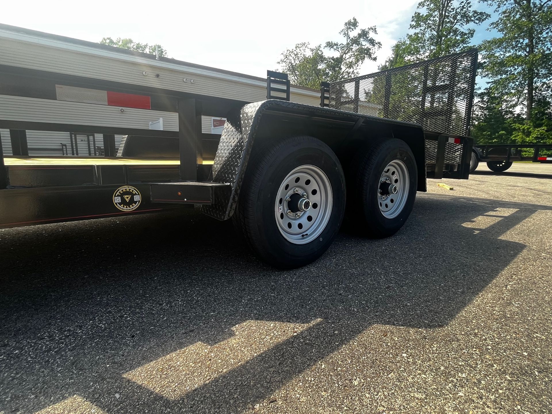 A trailer is parked on the side of the road