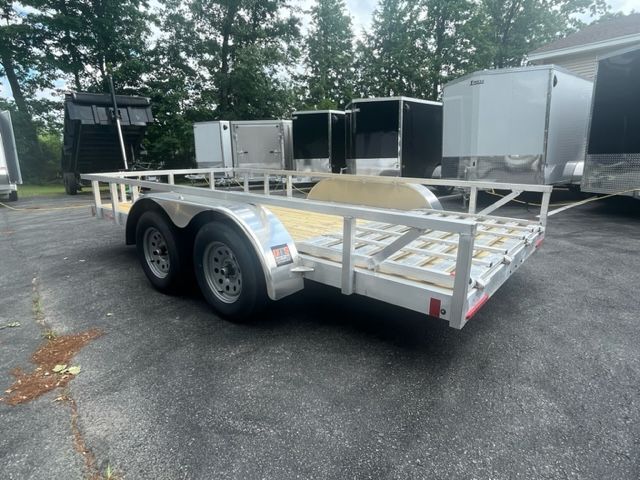 A trailer is parked in a parking lot with other trailers.