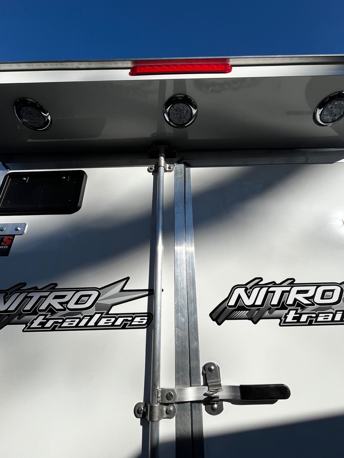 A white trailer with nitro trailers written on it