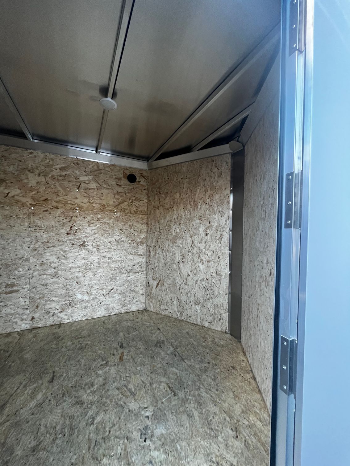 An empty trailer with a door