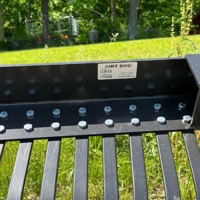 A metal fence with a dirt dog label on it