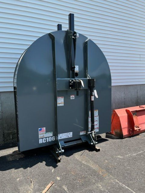 A large gray machine with the number rc168 on it