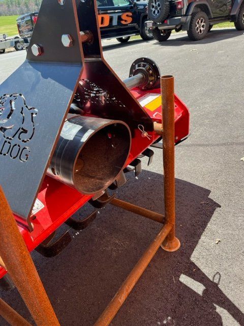 A red and black machine with the word dog on it