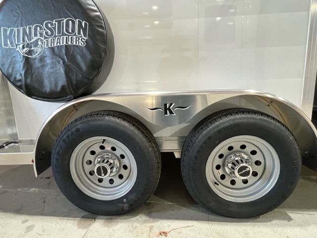 A kingston trailer with a spare tire cover on top of it