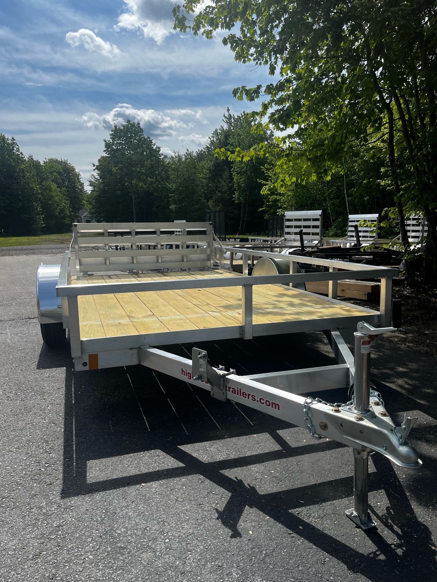 A trailer is parked on the side of the road