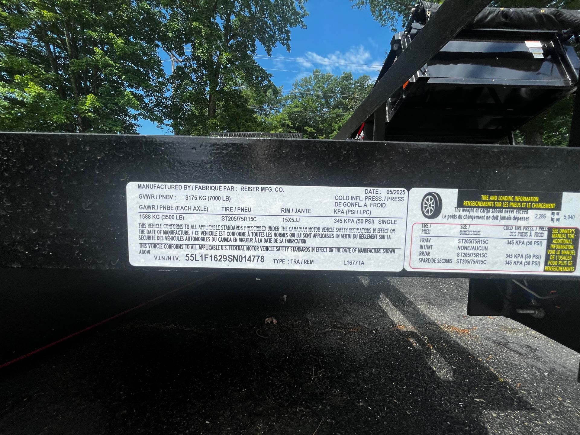 A trailer with a sticker on it that says ' warning ' on it