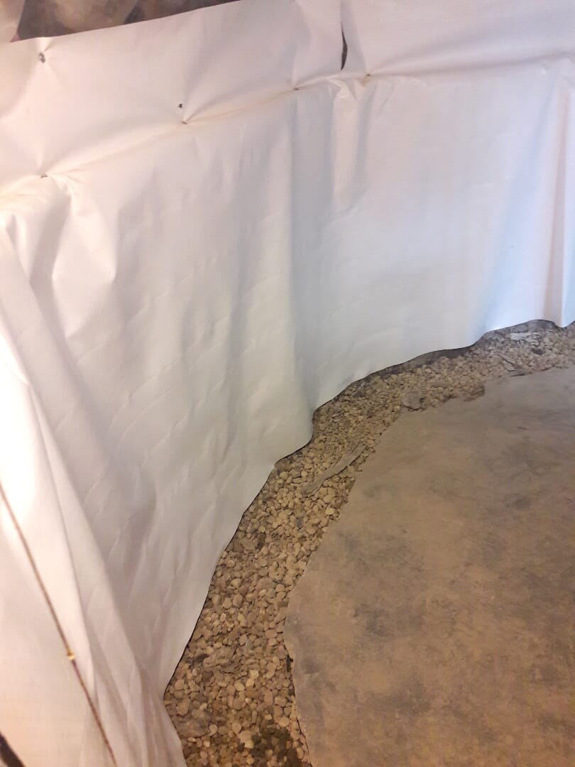 Cover perimeter with crushed rocks