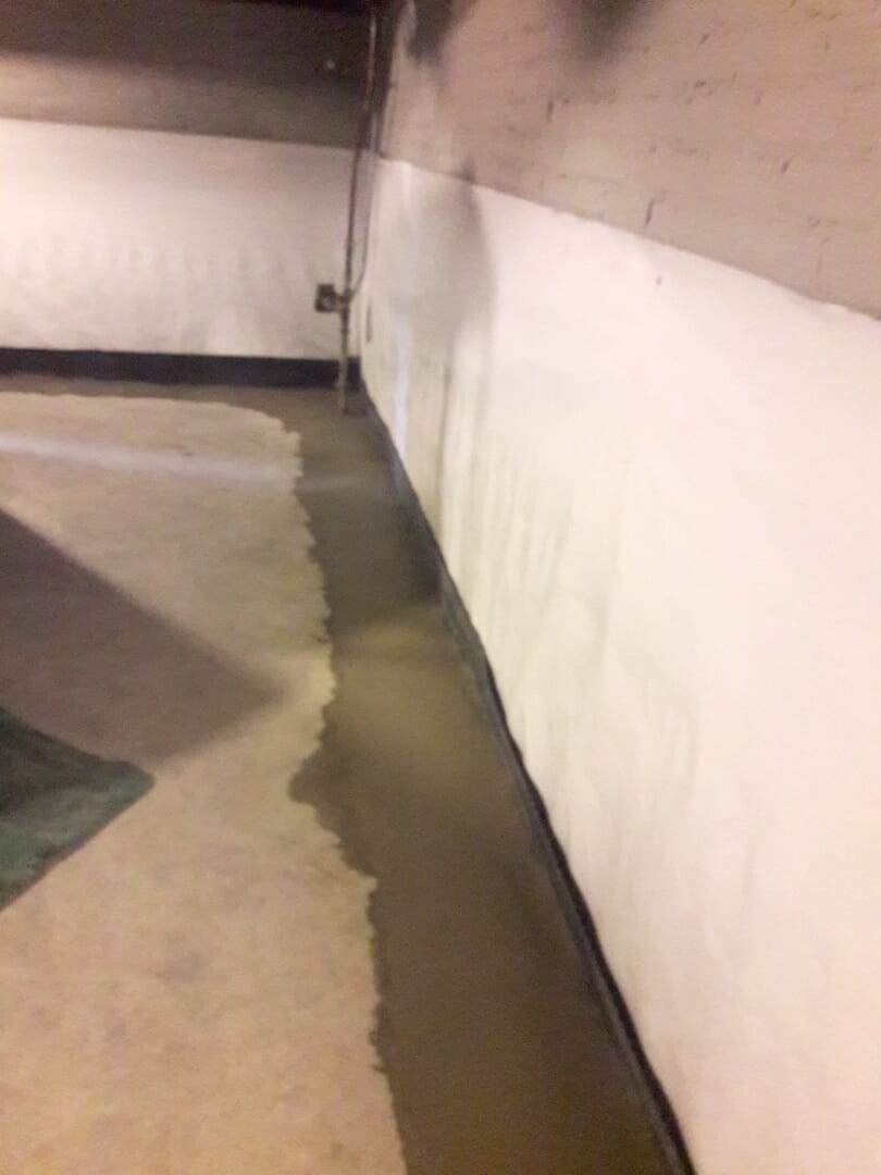 Lay plastic over rocks and top with concrete