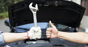 Mechanic hand holding a wrench
