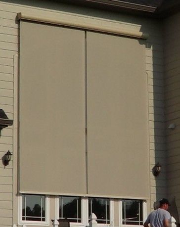 A house window covered with solar screens