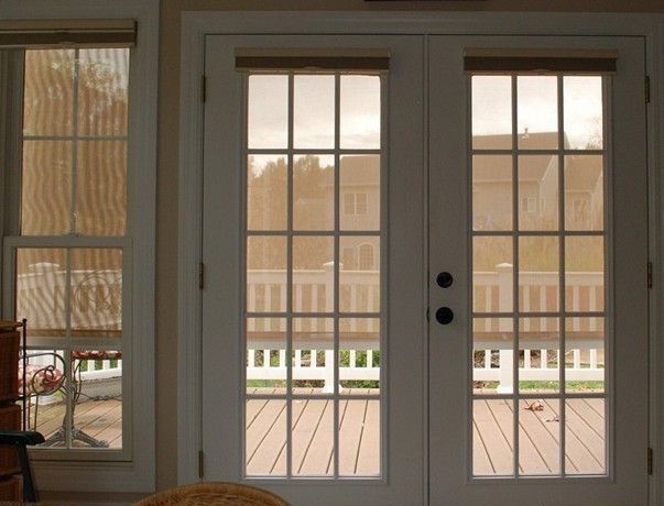 A patio door covered with a solar screen