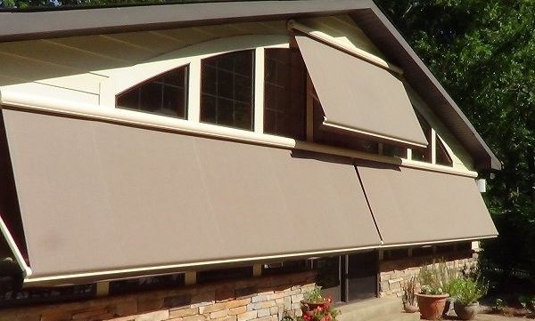 A house with an awning on the side of it