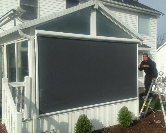 Sunroom covered with a solar screen