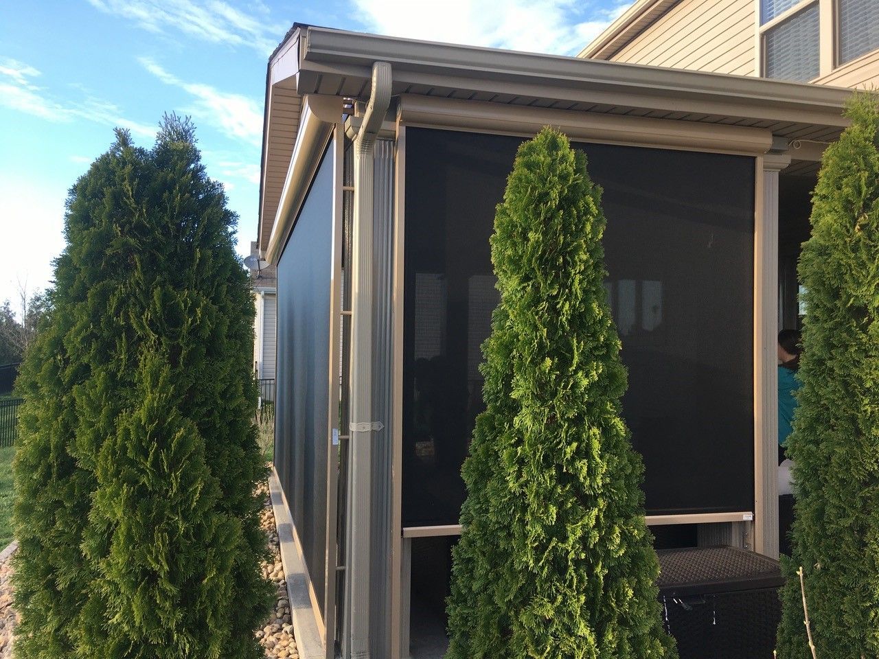 A sunroom covered with solar screens