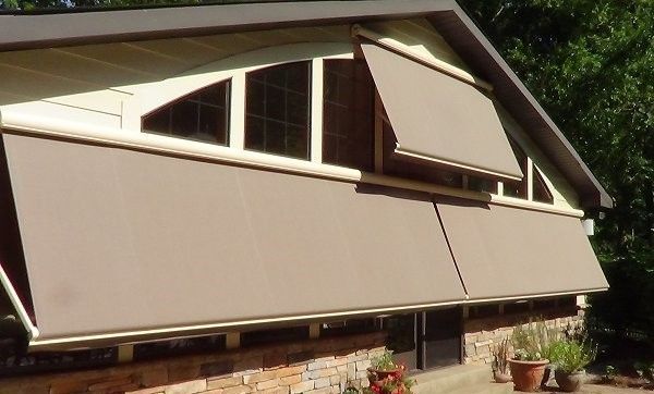 A house with an awning on the side of it