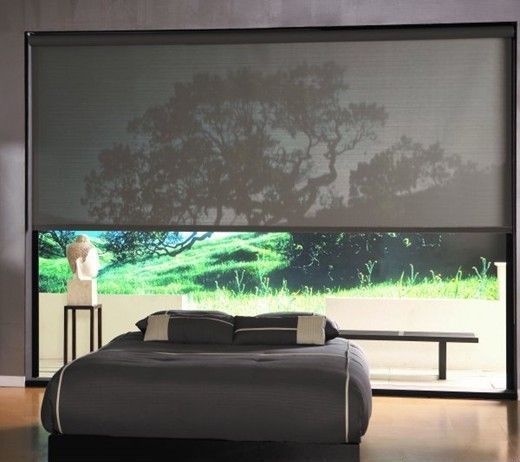 Bedroom with glass wall decor covered by solar screens